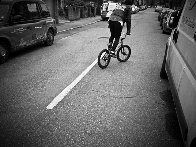 Panasonic rooftop rider: A biker rides the streets while standing up