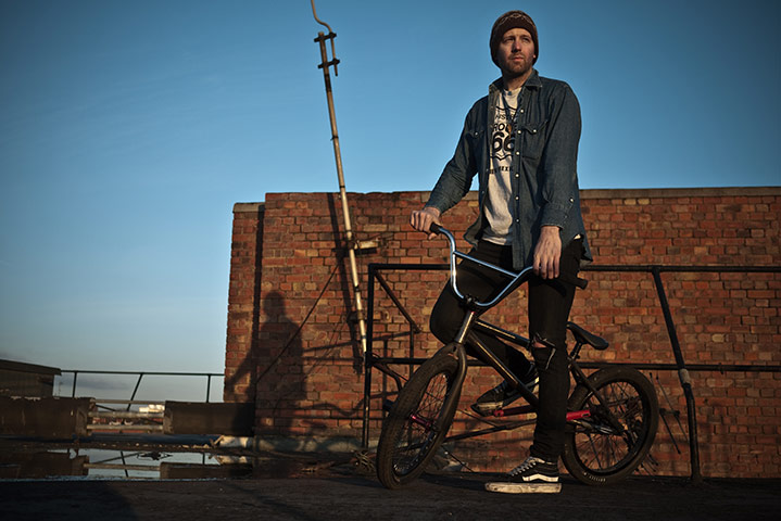 Panasonic rooftop rider: A man poses on a bike in the sunshine