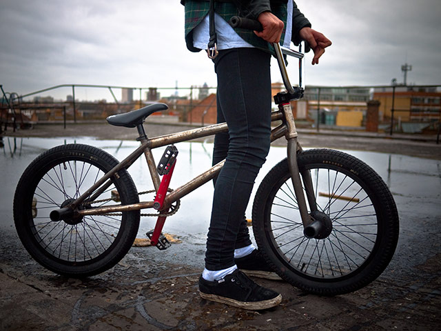 Panasonic rooftop rider: A bike on a roof under a grey sky