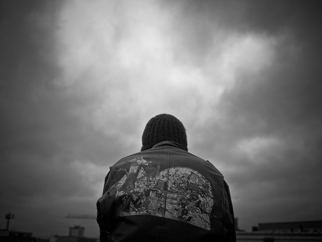 Panasonic rooftop rider: Back of a man wearing leather jacket 