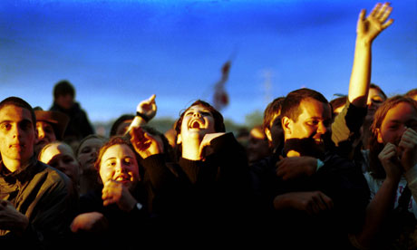 A crowd of teenagers watching a band at the Glastonbury Festival, June 2000