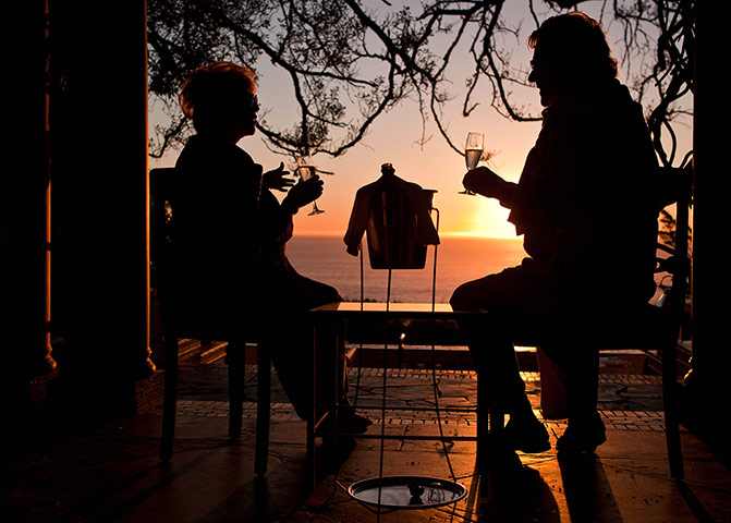 South Africa – : Gloria Hunniford and her husband enjoy dinner at sunset