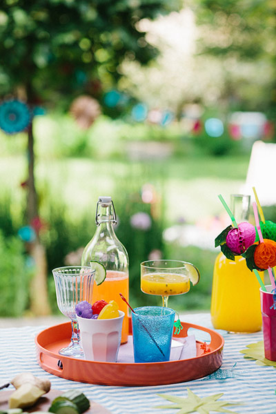Brita drinks: Tray of drinks in mismatched glasses on table outdoors