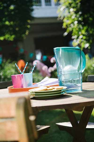 Brita drinks: Green Brita water jug on a table outdoors