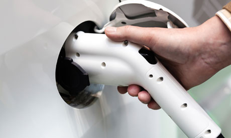 Electric car being charged