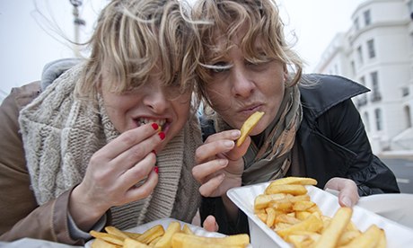 Girls eating chips. 