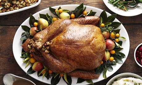 John Lewis: Turkey, stuffing, and gravy dishes on wood surface