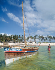 TUI: Kenya East Africa Traditional boat at Watamu Bay Beach in background