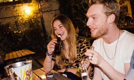 Man and woman in a pub at night