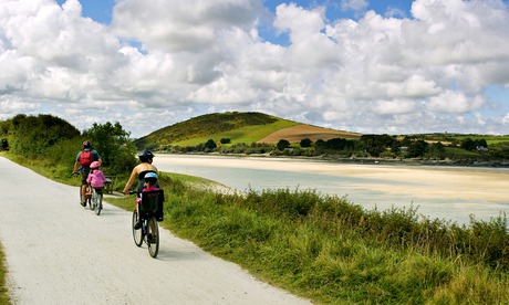 Enterprise: family cycling along the Camel Trail, near the Camel Estuary in Cornwall