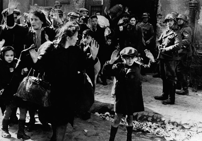 Europe 1900-1945: Terrified Jewish families surrender to German soldiers in the Warsaw ghetto