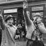 Europe 1900-1945: Three women raise their right arms to salute the German army, 1938
