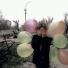 Europe 1945-2011: A girl festooned with balloons covers her eyes amid the ruins of Grozny