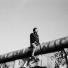 Europe 1945-2011: A young man sits atop the Berlin Wall