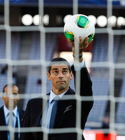 FIFA Club World Cup Final: A FIFA referee holds soccer ball as he tests GoalRef