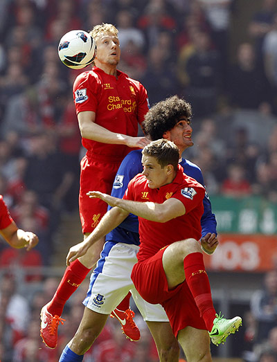 Liverpool v Everton: Everton's Marouane Fellaini battles for the ball with Liverpool's Jordan He