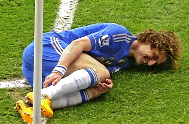 Manchester Utd vs Chelsea: In this TV image David Luiz of Chelsea smiles smugly as he gets Rafael Da S