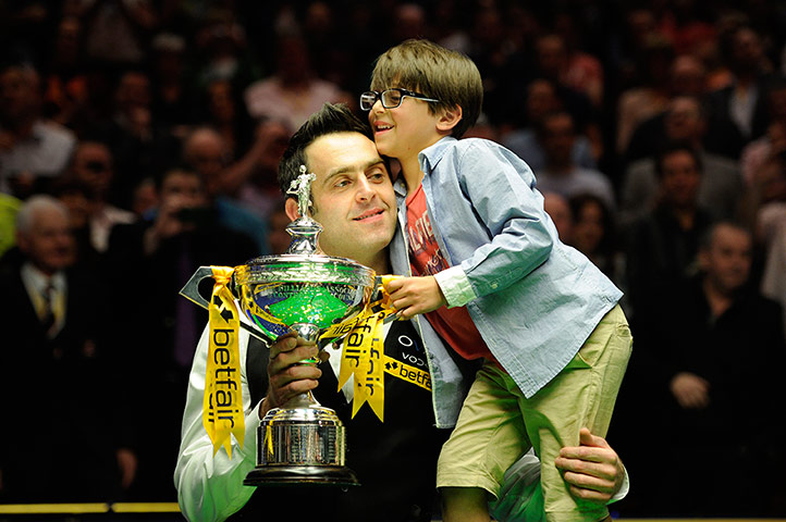 World Snooker: Ronnie O'Sullivan celebrates with the trophy and his son Ronnie jr gets a r