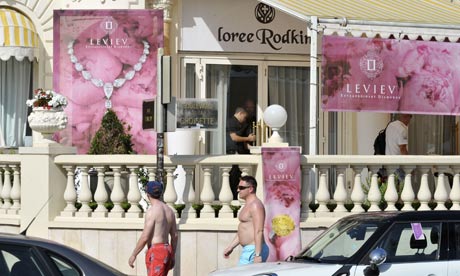 Police examine the crime scene at the Carlton Cannes jewellery Police examine the crime scene at the Carlton Cannes jewellery