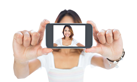 Happy asian woman taking a selfie