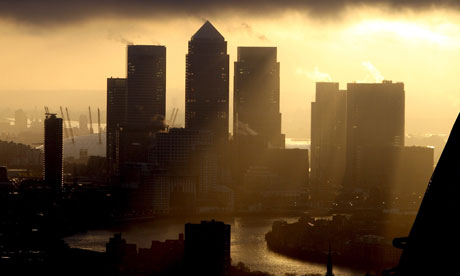 The sun rises over Canary Wharf, City of London