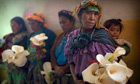 Relatives gather in a communal hall during the preparations for a mass burial in Patalcal, Guatemala