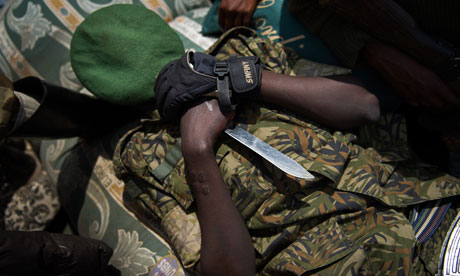 A Congolese M23 rebels sleeps in the back of a truck 