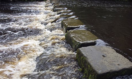 Stepping stones across a river after heavy rain<br />
