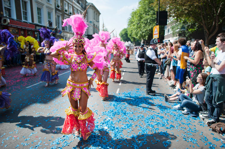 Performers dance in the parade on the second day of the Notting Hill Carnival in west London
