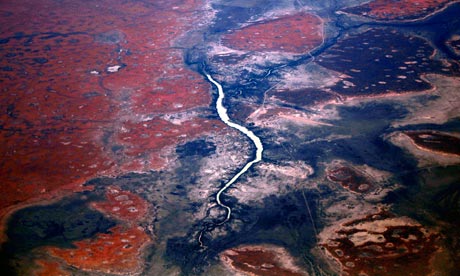A river flows among sand dunes in the Tanami Desert, in Australia's Northern Territory