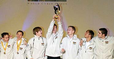 Dennis Schellhase, second from left, and his younger brother Dariel Schellhase of Germany, left, and their teammates jubilate together after winning the FIFA Soccer 2003 events of the 3rd World Cyber Games