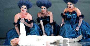 From left: Yvonne Howard, Lee Bisset and Susanna Tudor-Thomas tend to Toby Spence (Pamino) in ENO's the Magic Flute.