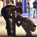 Woman helps her friend after leaving a bar in Bristol