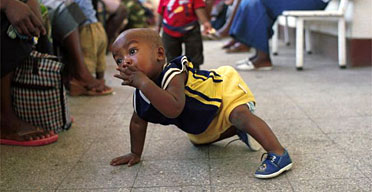 No one knows whether 11-month-old Keith Muchanga will escape a life with HIV, but the work of Médecins sans Frontières in Mozambique has given him a fighting chance. Photograph: Martin Godwin