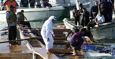 Bahraini search and rescue workers stand 