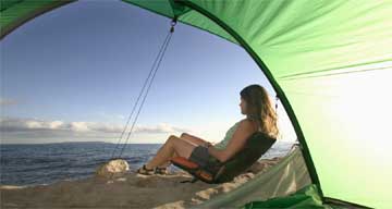 Lady camping on beach