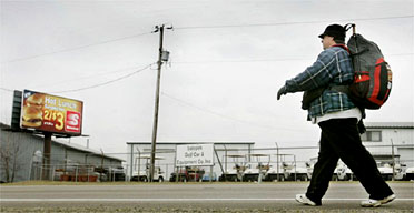 Steve Vaught walks along Route 201 in Vandalia, Ohio. Photograph: Eric Albrecht/AP