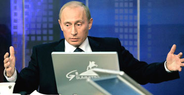 The Russian president, Vladimir Putin, answers questions during an online conference in Moscow ahead of next week's G8 summit. Photograph: Dmitry Astakhov/AP 