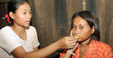 Rochom P'ngieng's supposed sister, Chanthy, tries to feed her