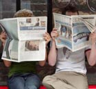 People reading newspapers