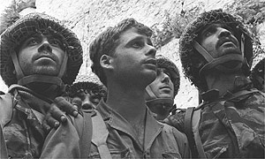 Israeli paratroopers Zion Karasente, Isack Ifat and Haim Oshiri view the Western Wall, following fierce fighting for the Old City during the six-day war in 1967