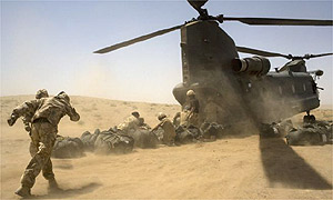 British soldiers loading supplies into a Chinook helicopter in southern Helmand province, Afghanistan