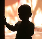 A child standing in a doorway