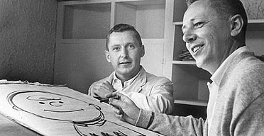 The real Charlie Brown, left, and Charles Schulz drawing his friends cartoon namesake.