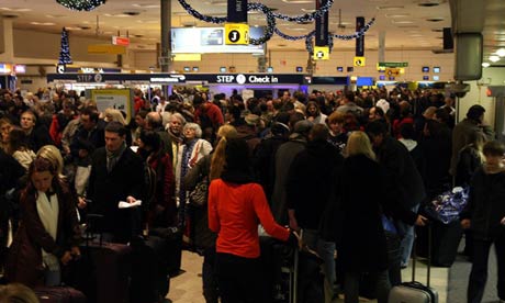 Passengers queue in Heathrow Airport's Terminal 1