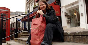 Writer Harriet Lane shopping with her ethical wheelie shopping bag in Kensington, London