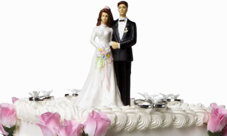 Wedding cake bride and groom Photograph Corbis