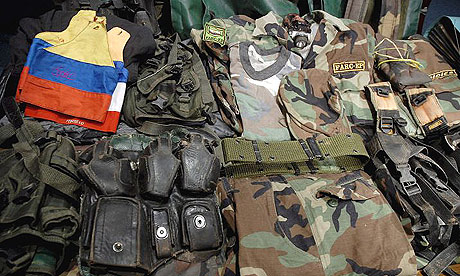 Uniforms and materials seized from the Colombian Revolutionary Armed Forces (FARC) displayed at a press conference in Quito, Ecuador.