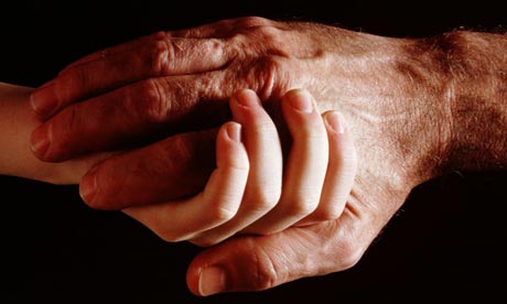 Elderly man and boy hold hands. Photograph: Henry Wolf/ Getty Images