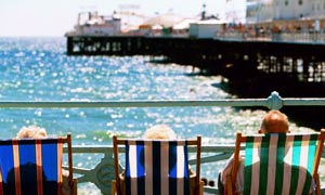 An elderly couple on Brighton beach